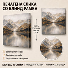 Вчитај ја сликата во галериски мод за гледање, Импозантни снежни планини се издигнуваат над мирно езеро, чии води го одразуваат златно-кафеавиот планински пејзаж.